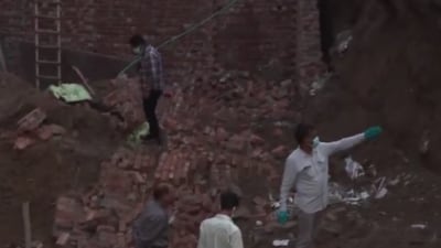 Rescue teams work at the site of an under-construction building that collapsed in Delhi’s Paharganj area. (Video grab) Rescue teams work at the site of an under-construction building that collapsed in Delhi’s Paharganj area. (Video grab)