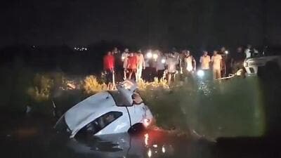 The speeding car lost control and rammed into an electric pole, before plunging into a nearby canal. The speeding car lost control and rammed into an electric pole, before plunging into a nearby canal.
