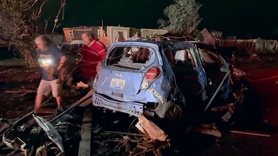 In this still image obtained from the Laurel County Fiscal Court in Kentucky, local residents search through tornado damage in Laurel County near London, Kentucky, on May17, 2025. (AFP) In this still image obtained from the Laurel County Fiscal Court in Kentucky, local residents search through tornado damage in Laurel County near London, Kentucky, on May17, 2025. (AFP)