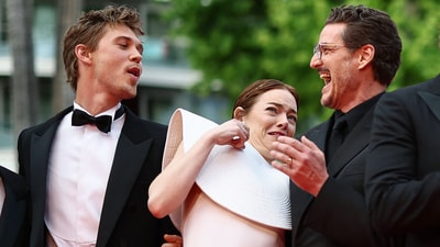 Cast members Emma Stone, Pedro Pascal, and Austin Butler avoid a bee during the screening of the film Eddington, in competition at the 78th Cannes Film Festival in Cannes. (REUTERS)