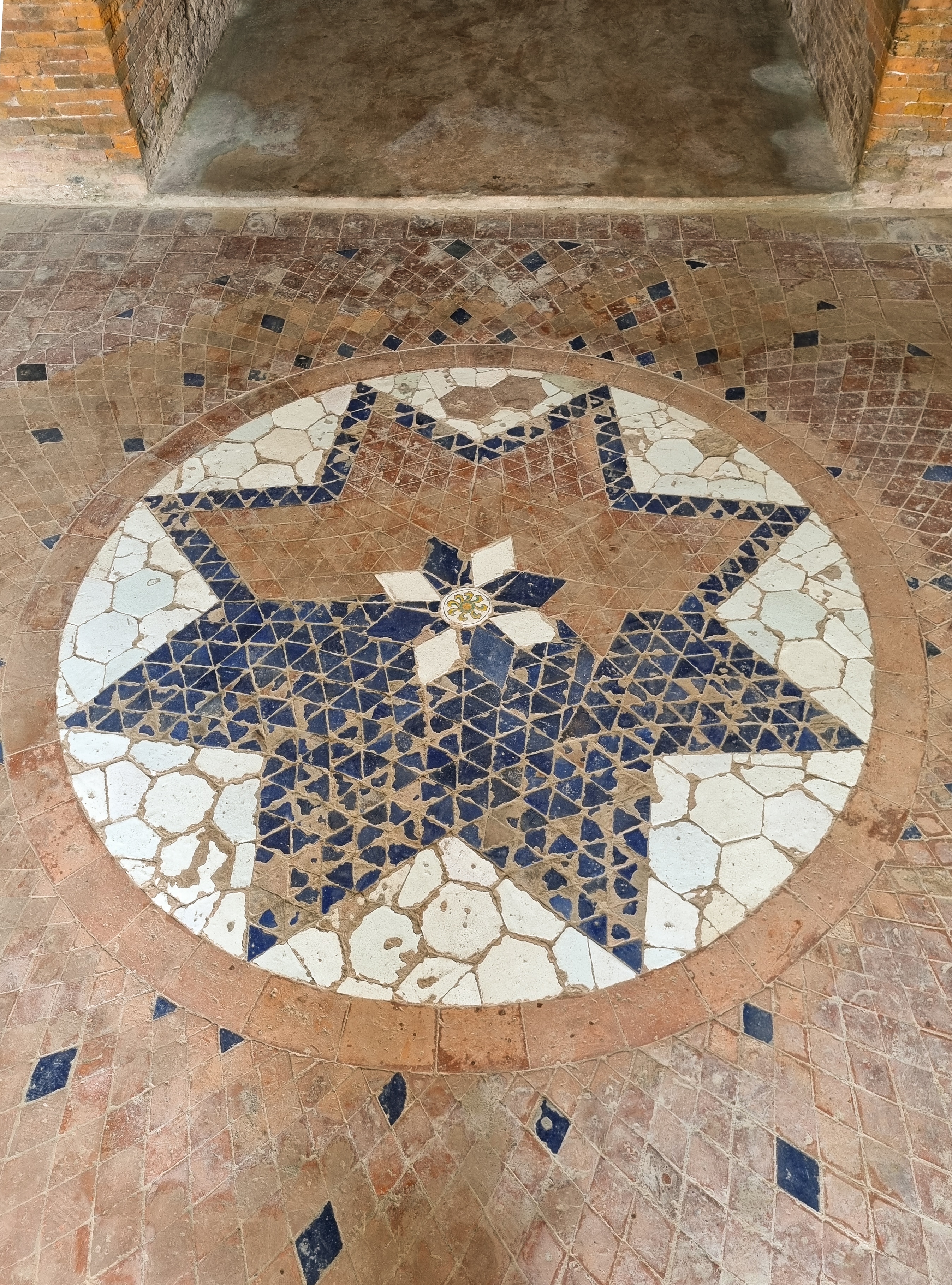 The largely intact mosaic star on the floor of the Lotton Mosque. (Leah Verghese)