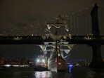 A tug boat helps stabilize the Cuauhtémoc, a masted Mexican Navy training ship as it sits stranded near the Manhattan Bridge after colliding with the Brooklyn Bridge on Saturday, A tug boat helps stabilize the Cuauhtémoc, a masted Mexican Navy training ship as it sits stranded near the Manhattan Bridge after colliding with the Brooklyn Bridge on Saturday,