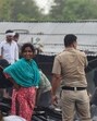 People salvage charred belongings from a site where a massive fire erupted at a slum area in Sector-52A near Ardee Mall in Gurugram on Saturday. (Parveen Kumar/Hindustan Times)