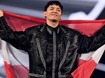 Austrian singer Johannes Pietsch, known as JJ representing Austria with the song "Wasted Love" parades during the flag ceremony prior to the grand final of the Eurovision Song Contest 2025, at the St. Jakobshalle arena in Basel on May 17, 2025. (Photo by Fabrice COFFRINI / AFP)