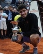 Spain's Carlos Alcaraz poses with the trophy after winning the Rome Masters final against Italy's world No.1 Jannik Sinner on Sunday. (REUTERS) Spain's Carlos Alcaraz poses with the trophy after winning the Rome Masters final against Italy's world No.1 Jannik Sinner on Sunday. (REUTERS)