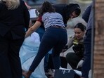 PALM SPRINGS, CALIFORNIA: Investigators look at possible evidence near the American Reproductive Centers fertility clinic following a bomb blast on May 17, 2025 in Palm Springs, California.   David McNew/Getty Images/AFP (Photo by DAVID MCNEW / GETTY IMAGES NORTH AMERICA / Getty Images via AFP)