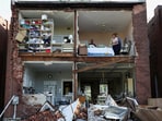 Residents inspect their home after a tornado completely tore off the back wall of a two-story house in St. Louis, Missouri.Keith Clark, whose family huddled in a closet during the storm, told USA Today “It was really bad. Then hearing neighbors scream and you can’t get to them, it’s pretty scary."