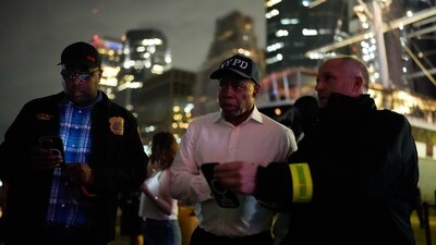 New York City Mayor Eric Adams inspects the site of the tragedy. 