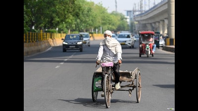 As temperatures rise, commuters cover their heads to escape the heat in Sector 38A on Sunday, May 18, 2025. (For representation only) As temperatures rise, commuters cover their heads to escape the heat in Sector 38A on Sunday, May 18, 2025. (For representation only)