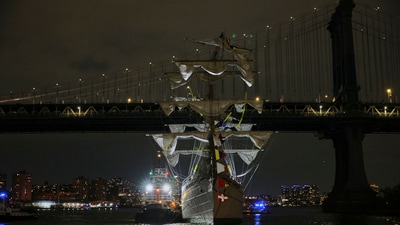 A tug boat helps stabilize the Cuauhtémoc, a masted Mexican Navy training ship as it sits stranded near the Manhattan Bridge after colliding with the Brooklyn Bridge on Saturday, (AP) A tug boat helps stabilize the Cuauhtémoc, a masted Mexican Navy training ship as it sits stranded near the Manhattan Bridge after colliding with the Brooklyn Bridge on Saturday, (AP)