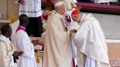 Pope Leo XIV receives the pallium from Cardinal Zenari, marking the formal start of his papacy. (AFP) Pope Leo XIV receives the pallium from Cardinal Zenari, marking the formal start of his papacy. (AFP)