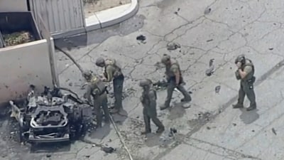 Law enforcement investigate a vehicle after an explosion on Saturday, May 17, 2025 in Palm Springs, Calif. A person perished following a car explosion close to a reproductive clinic in California. (AP) Law enforcement investigate a vehicle after an explosion on Saturday, May 17, 2025 in Palm Springs, Calif. A person perished following a car explosion close to a reproductive clinic in California. (AP)