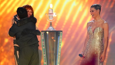 2024 Eurovision Song Contest Winner Nemo congratulates 2025 Eurovision Song Contest Winner JJ, representing Austria, during the Grand Final, in Basel, Switzerland, May 18, 2025. REUTERS/Denis Balibouse (REUTERS)