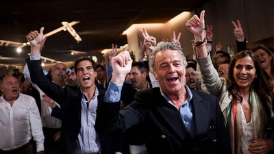Democratic Alliance (AD) supporters react to exit-poll results during the election night in Lisbon on May 18, 2025. (AFP) Democratic Alliance (AD) supporters react to exit-poll results during the election night in Lisbon on May 18, 2025. (AFP)