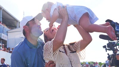 Scottie Scheffler, left, is greeted by his wife Meredith, center, and their son Bennett after winning the CJ Cup Byron Nelson (AP)