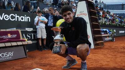 Spain's Carlos Alcaraz poses with the trophy after winning the Rome Masters final against Italy's world No.1 Jannik Sinner on Sunday. (REUTERS)