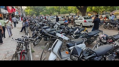 Two-wheelers and four-wheelers are often parked haphazardly, blocking pathways and exits, said Sharanjit Singh, president of the Sector 8 market association. (Keshav Singh/HT) Two-wheelers and four-wheelers are often parked haphazardly, blocking pathways and exits, said Sharanjit Singh, president of the Sector 8 market association. (Keshav Singh/HT)