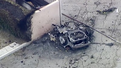 A destroyed car remains after a bomb blast near a fertility clinic in the Palm Springs on May 17, 2025. This is a still image from a video. (REUTERS)