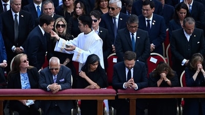  A priest administers Communion to U.S. Secretary of State Marco Rubio and his wife Jeanette during the Holy Mass for the beginning of Pope Leo XIV’s pontificate in St. Peter’s Square. (Photo by Isabella BONOTTO / AFP) (AFP) A priest administers Communion to U.S. Secretary of State Marco Rubio and his wife Jeanette during the Holy Mass for the beginning of Pope Leo XIV’s pontificate in St. Peter’s Square. (Photo by Isabella BONOTTO / AFP) (AFP)
