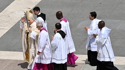 Pope Leo XIV departs St. Peter’s Square after delivering the Regina Caeli at his inaugural Mass. (Photo by Isabella BONOTTO / AFP) (AFP) Pope Leo XIV departs St. Peter’s Square after delivering the Regina Caeli at his inaugural Mass. (Photo by Isabella BONOTTO / AFP) (AFP)