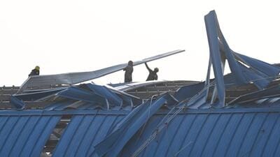 Workers assess the damage and fix the roof at the New Ashok Nagar RRTS station. (Sanjeev Verma/HT Photo) Workers assess the damage and fix the roof at the New Ashok Nagar RRTS station. (Sanjeev Verma/HT Photo)