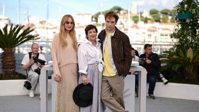 Jennifer Lawrence along with director Lynne Ramsay and co-star Robert Pattinson during the photocall for Die, My Love at the 78th edition of the Cannes Film Festival. (Photo by Miguel MEDINA / AFP) (AFP)