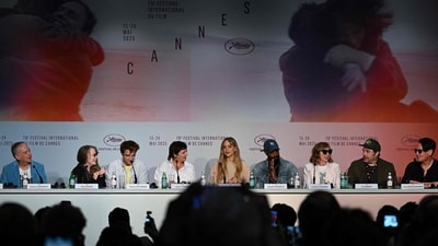 Cinematographer Seamus Mcgarvey, actor Sissy Spacek, Robert Pattinson, director, screenwriter, cinematographer Lynne Ramsay, Jennifer Lawrence, actor Lakeith Stanfield, costume designer Catherine George, Production Designer Tim Grimes and film editor Toni Froschammer attend a press conference for Die, My Love at the 78th edition of the Cannes Film Festival. (Photo by Anna KURTH / AFP) (AFP)