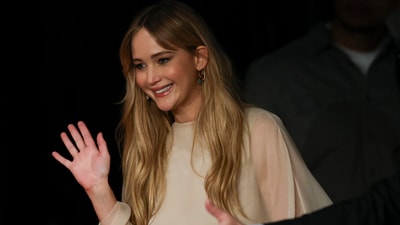 Jennifer Lawrence was all smiles as she walked into the press conference for the film Die, My Love. REUTERS/Stephane Mahe (REUTERS)