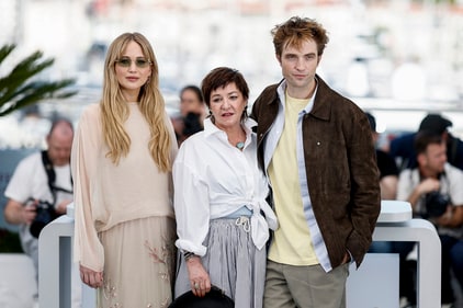Director Lynne Ramsay and cast members Jennifer Lawrence and Robert Pattinson pose during a photocall for the film "Die, My Love" in competition at the 78th Cannes Film Festival in Cannes, France, May 18, 2025. REUTERS/Benoit Tessier (REUTERS)