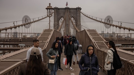 The Brooklyn Bridge was the the first steel-wire suspension bridge and world's longest suspension bridge when it was constructed. (Bloomberg)