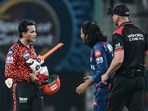 Sunrisers Hyderabad's Abhishek Sharma (L) reacts after his dismissal by Lucknow Super Giants' Digvesh Rathi (C). Sunrisers Hyderabad's Abhishek Sharma (L) reacts after his dismissal by Lucknow Super Giants' Digvesh Rathi (C).