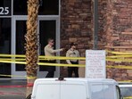 Las Vegas Metro Police officers are shown by the main entrance of a Las Vegas Athletic Club after a shooting Friday, May 16, 2025. 2025, in Las Vegas. Las Vegas Metro Police officers are shown by the main entrance of a Las Vegas Athletic Club after a shooting Friday, May 16, 2025. 2025, in Las Vegas.