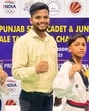 Taekwondo champions Chetan Gupta and Manmeet Kaur with their coach in Ludhiana. (HT Photo)