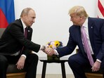 File photo of Russia's President Vladimir Putin and US President Donald Trump shaking hands during a bilateral meeting.