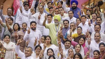 BJP members wave the victory sign upon sweeping the recent mayoral elections. (PTI) BJP members wave the victory sign upon sweeping the recent mayoral elections. (PTI)