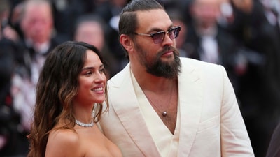 Adria Arjona, left, and Jason Momoa pose for photographers upon arrival at the premiere of the film 'Highest 2 Lowest' at the 78th international film festival, Cannes, southern France, Monday, May 19, 2025. (Photo by Lewis Joly/Invision/AP) (Lewis Joly/Invision/AP) Adria Arjona, left, and Jason Momoa pose for photographers upon arrival at the premiere of the film 'Highest 2 Lowest' at the 78th international film festival, Cannes, southern France, Monday, May 19, 2025. (Photo by Lewis Joly/Invision/AP) (Lewis Joly/Invision/AP)
