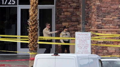 Las Vegas Metro Police officers are shown by the main entrance of a Las Vegas Athletic Club after a shooting Friday, May 16, 2025. 2025, in Las Vegas. (AP)