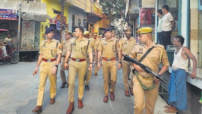 Police carry out a march in Sambhal on Monday. (PTI) Police carry out a march in Sambhal on Monday. (PTI)