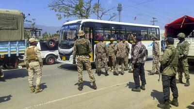 Security personnel stand guard amid tensions in Kangpokpi district of Manipur. (PTI Photo)