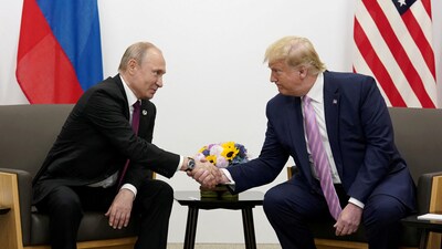File photo of Russia's President Vladimir Putin and US President Donald Trump shaking hands during a bilateral meeting. (REUTERS)