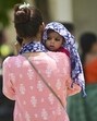 A woman shields her child from the scorching heat on a hot summer day in Prayagraj. (PTI Photo) A woman shields her child from the scorching heat on a hot summer day in Prayagraj. (PTI Photo)