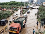 Commuters wade through a severly waterlogged road after incessant rainfall in several parts of the region, at Sai Layout in Bengaluru on Monday. Commuters wade through a severly waterlogged road after incessant rainfall in several parts of the region, at Sai Layout in Bengaluru on Monday.