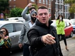 Far-right and anti-Islam activist Stephen Yaxley-Lennon, known as Tommy Robinson, gestures before arriving at Folkestone Police Station in Folkestone, Britain, October 25, 2024.