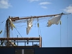 US safety officials launched a probe Sunday after a 150-foot tall Mexican sailing ship crashed into New York's iconic Brooklyn Bridge, snapping its masts and killing two crew members.