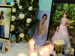 Candles, flowers and photos of America Sanchez, a cadet who died after the Mexican Navy ship Cuauhtemoc crashed into the Brooklyn Bridge in New York City, are kept on a table as family and friends gather to pay tribute to her at her home in Xalapa, Mexico May 18, 2025. REUTERS/Oscar Martinez