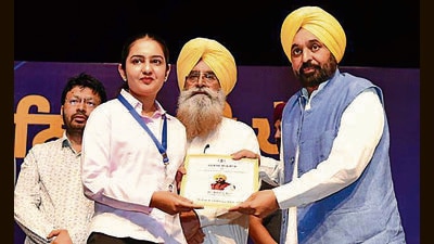 A recruit receives a job letter in Chandigarh on Tuesday. (HT)