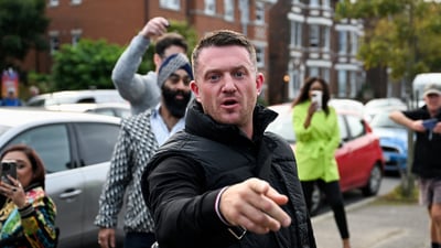 Far-right and anti-Islam activist Stephen Yaxley-Lennon, known as Tommy Robinson, gestures before arriving at Folkestone Police Station in Folkestone, Britain, October 25, 2024. (REUTERS File)