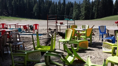 Chairs and tables scattered at the site of terrorist attack on tourists in Baisaran near Pahalgam in south Kashmir's Anantnag district. (REUTERS File)