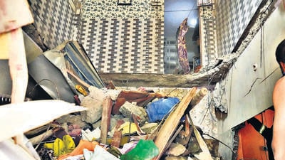 Kalyan, India -May 20 2025: Pic A slab from the second floor of the Ground -plus- 4 Saptashrungi building in Mangal ragho Nagar, Kalyan East, collapsed around 2:30 PM on Tuesday. The debris fell through to the ground floor. One senior citizen woman has been rescued so far. KDMC’s fire brigade and disaster management teams are on site, and rescue operations are ongoing. The building was constructed around 2002." Pic on Tuesday in India on 20 2025 - Story By Anamika Gharat ( Photo By Pramod Tambe).
