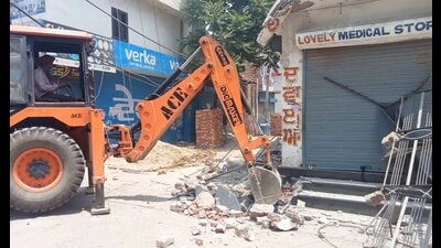 The medical shop of the accused drug peddler being razed in the Daba area in Ludhiana on Tuesday. (HT Photo)